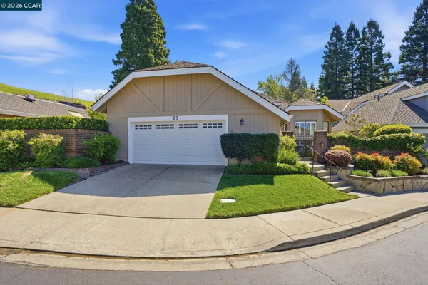 a view of front of house with a yard