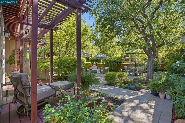 a view of a chairs in backyard of the house