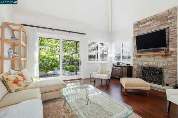 a living room with furniture fireplace and a flat screen tv
