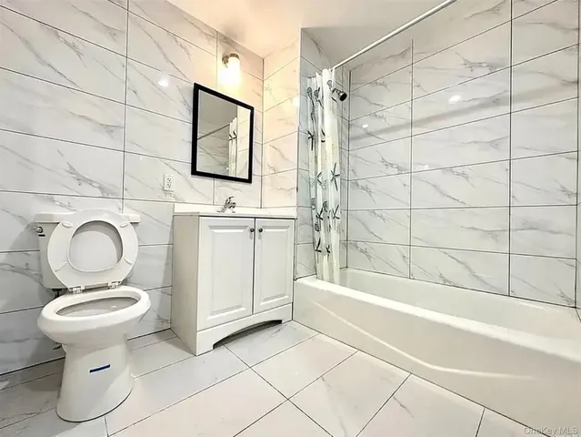a bathroom with a toilet and a sink