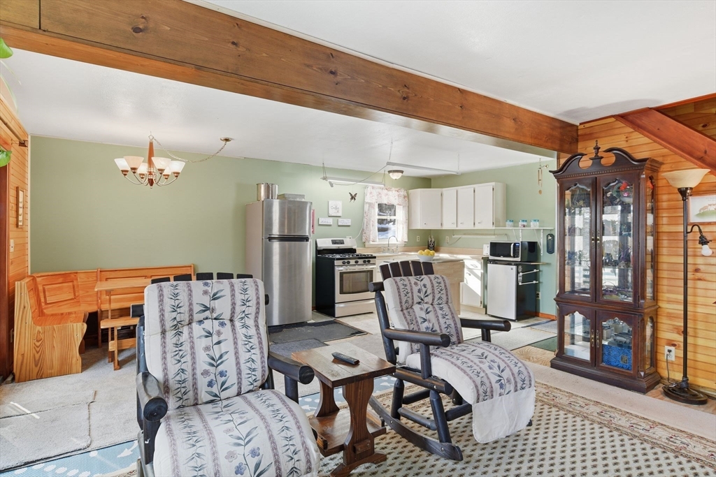 200 Fox Den Road Tolland, MA 01034 - Photo 10 of 37 a living room with furniture and a table