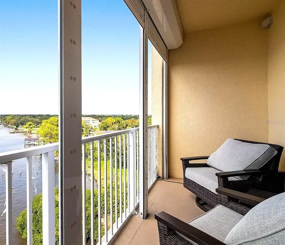 a view of a balcony with chairs