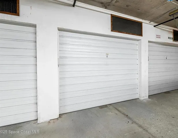 a large white room with a large window and couch