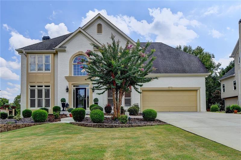 3740 Preakness Lane Suwanee, GA 30024 - Photo 1 of 1 a front view of a house with garden
