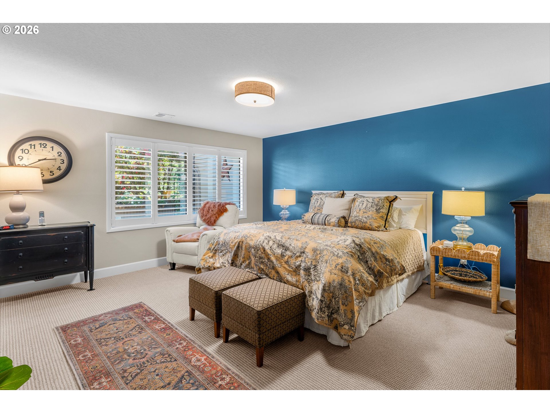 77 Condolea Way Lake Oswego, OR 97035 - Photo 13 of 25 a bedroom with a bed a dresser and a window