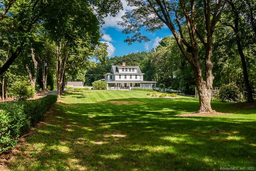 321 Boston Post Road Madison, CT 06443 - Photo 1 of 1 a garden view with a fountain