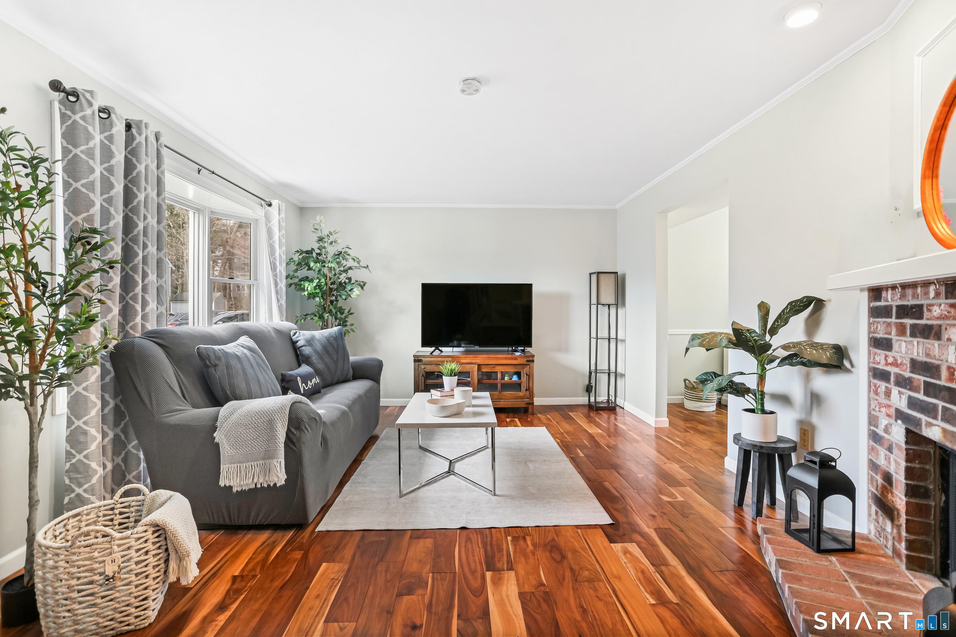 40 Sullivan Place Bridgeport, CT 06610 - Photo 5 of 21 a living room with furniture and a flat screen tv