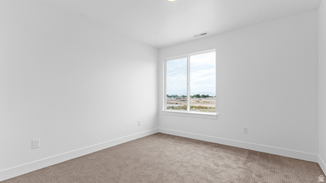 4170 North 560th West, Unit 6 Tooele, UT 84074 - Photo 15 of 20 Carpeted room with a large window and white trim