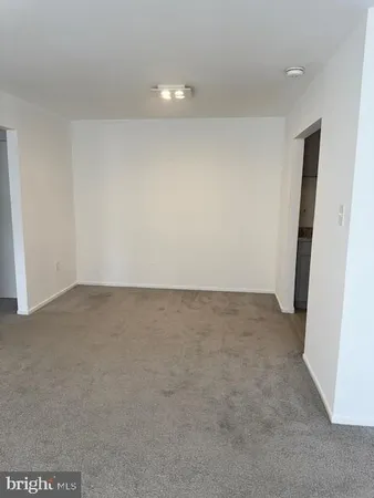 a utility room with cabinets washer and dryer