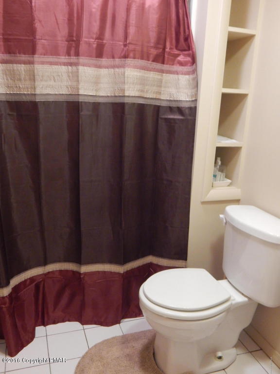 1105 Hampstead Road Bushkill, PA 18324 - Photo 23 of 35 a bathroom with a toilet a sink and bathtub