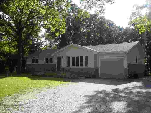 34612 North Wilson Road Ingleside, IL 60041 - Photo 1 of 1 a front view of a house with a yard and garage