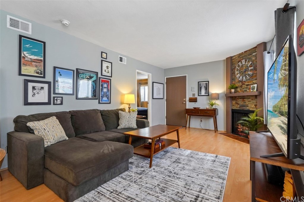 320 McHenry Road, Unit 20 Glendale, CA 91206 - Photo 1 of 27 a living room with furniture and a flat screen tv