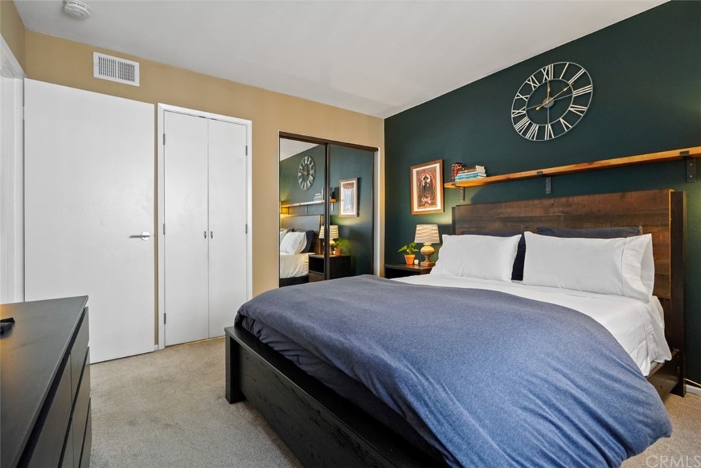 320 McHenry Road, Unit 20 Glendale, CA 91206 - Photo 13 of 27 a bedroom with a bed and a dresser