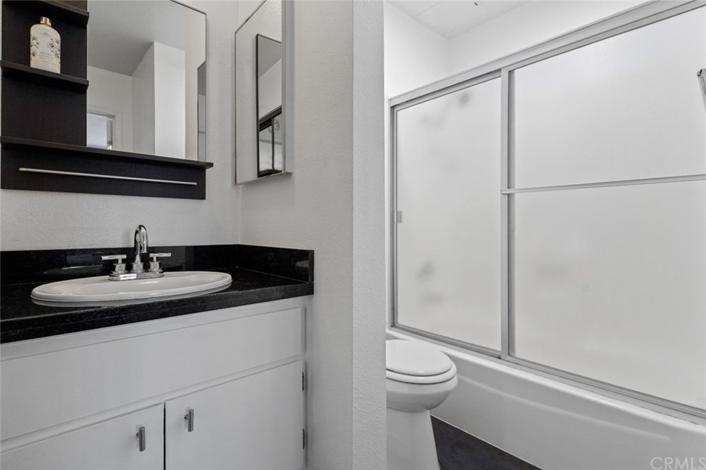 320 McHenry Road, Unit 20 Glendale, CA 91206 - Photo 14 of 27 a bathroom with a sink and a mirror
