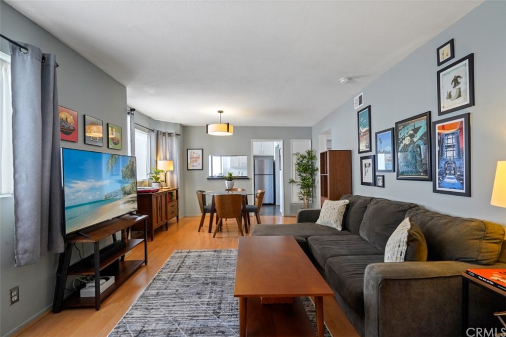 320 McHenry Road, Unit 20 Glendale, CA 91206 - Photo 2 of 27 a living room with furniture and a flat screen tv