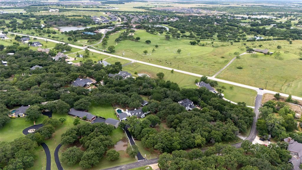 8948 David Fort Road Argyle, TX 76226 - Photo 37 of 39 Aerial perspective showcasing a residential area with extensive tree coverage