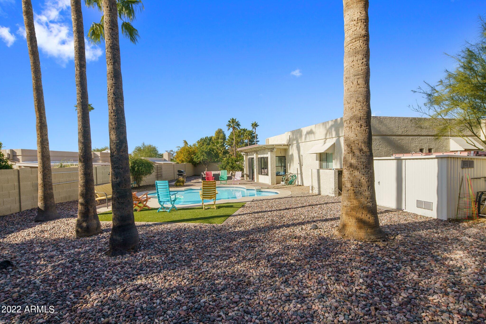 6609 East Phelps Road Scottsdale, AZ 85254 - Photo 72 of 83 a front view of a house with a yard