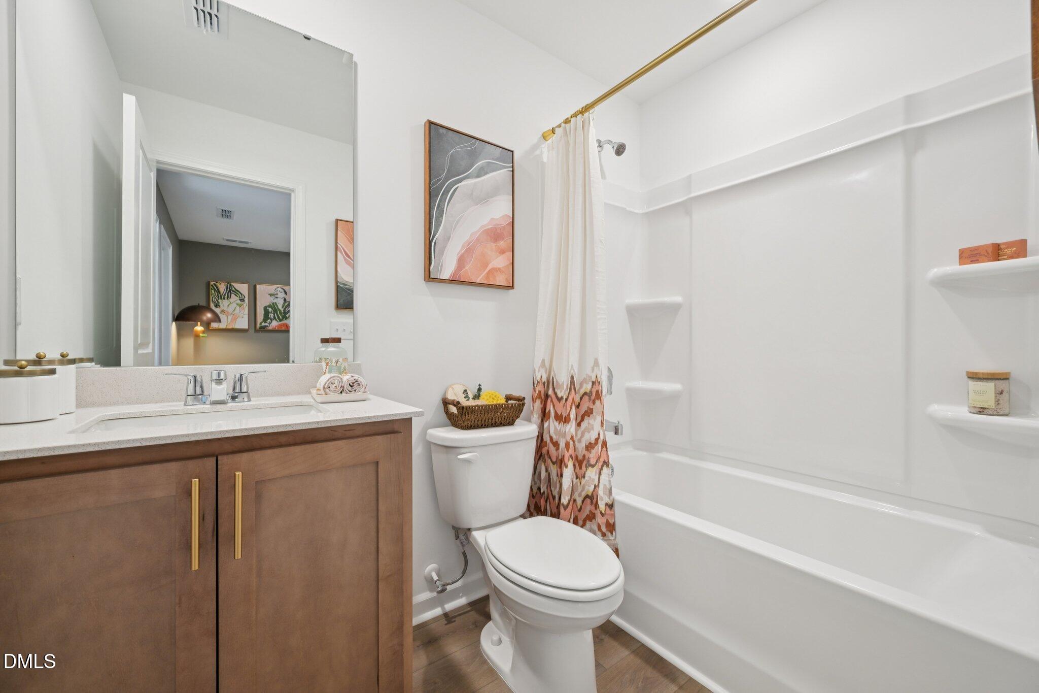 1623 Mirth Court Rolesville, NC 27571 - Photo 11 of 29 a bathroom with a sink toilet and shower