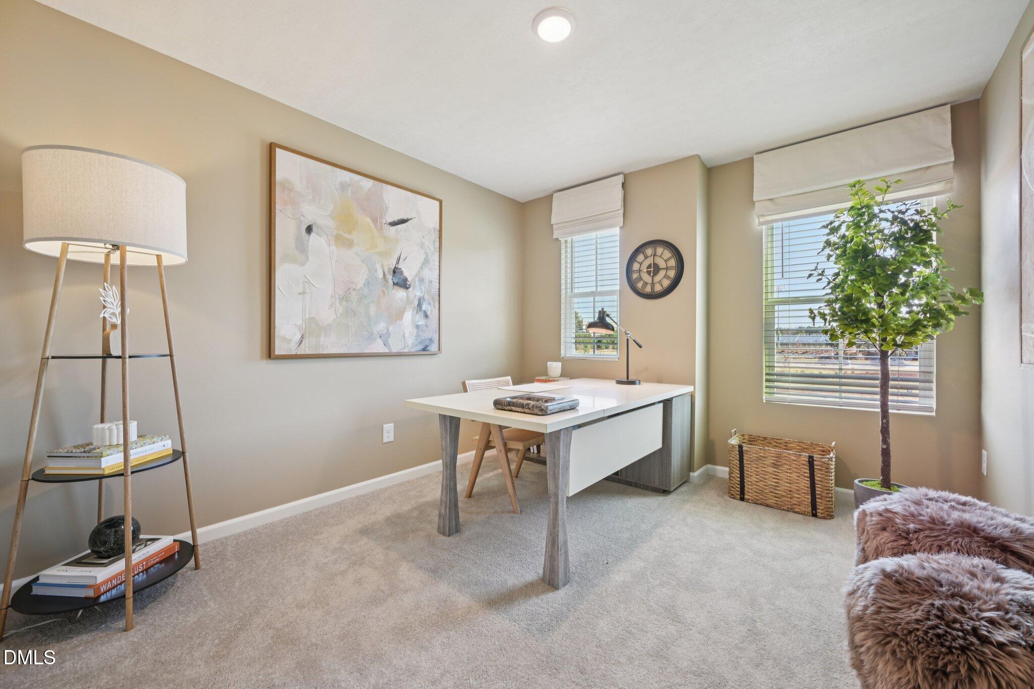 1623 Mirth Court Rolesville, NC 27571 - Photo 13 of 29 a living room with a window and a table