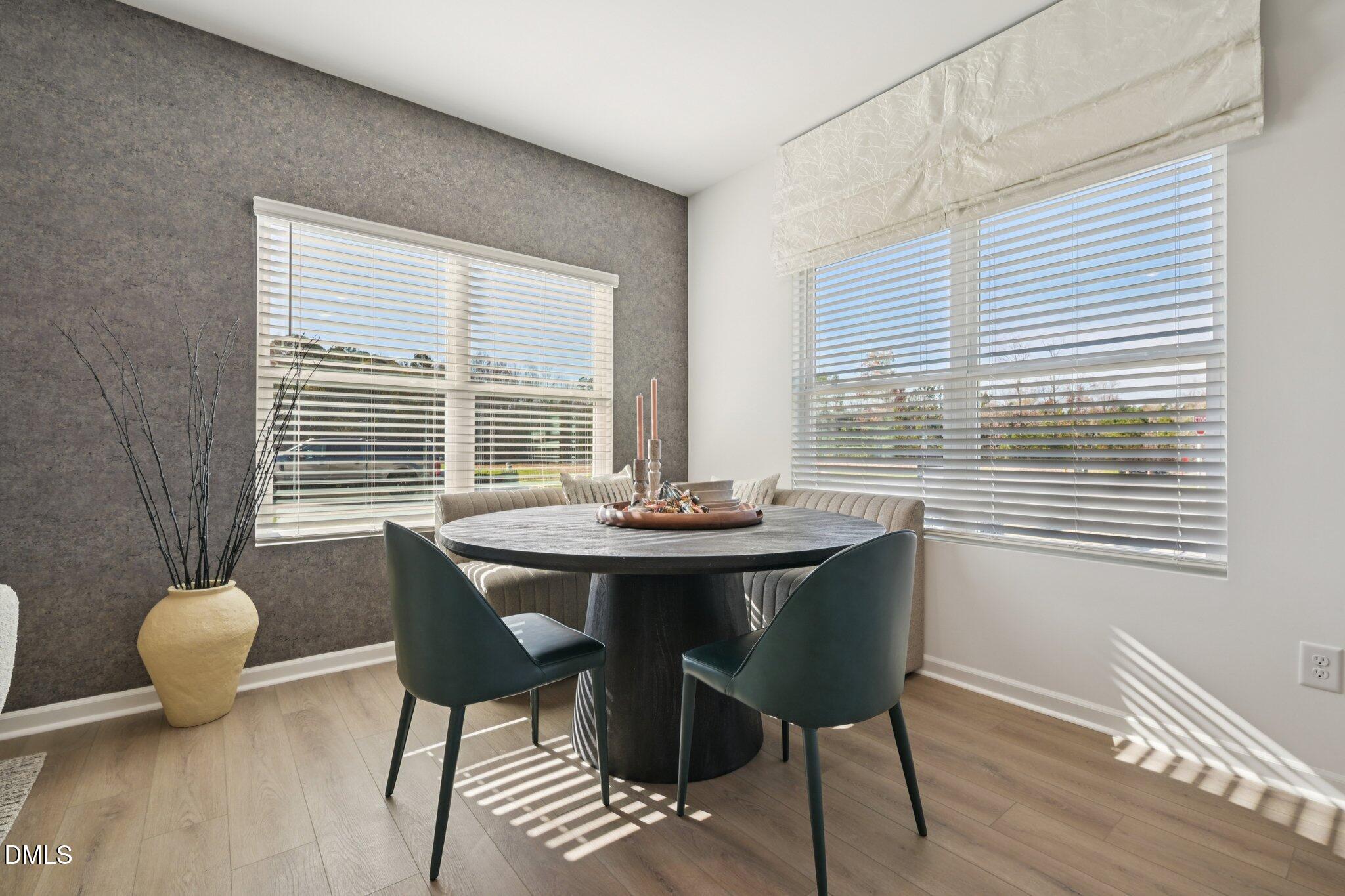 1623 Mirth Court Rolesville, NC 27571 - Photo 6 of 29 a view of a dining room with furniture window and outside view