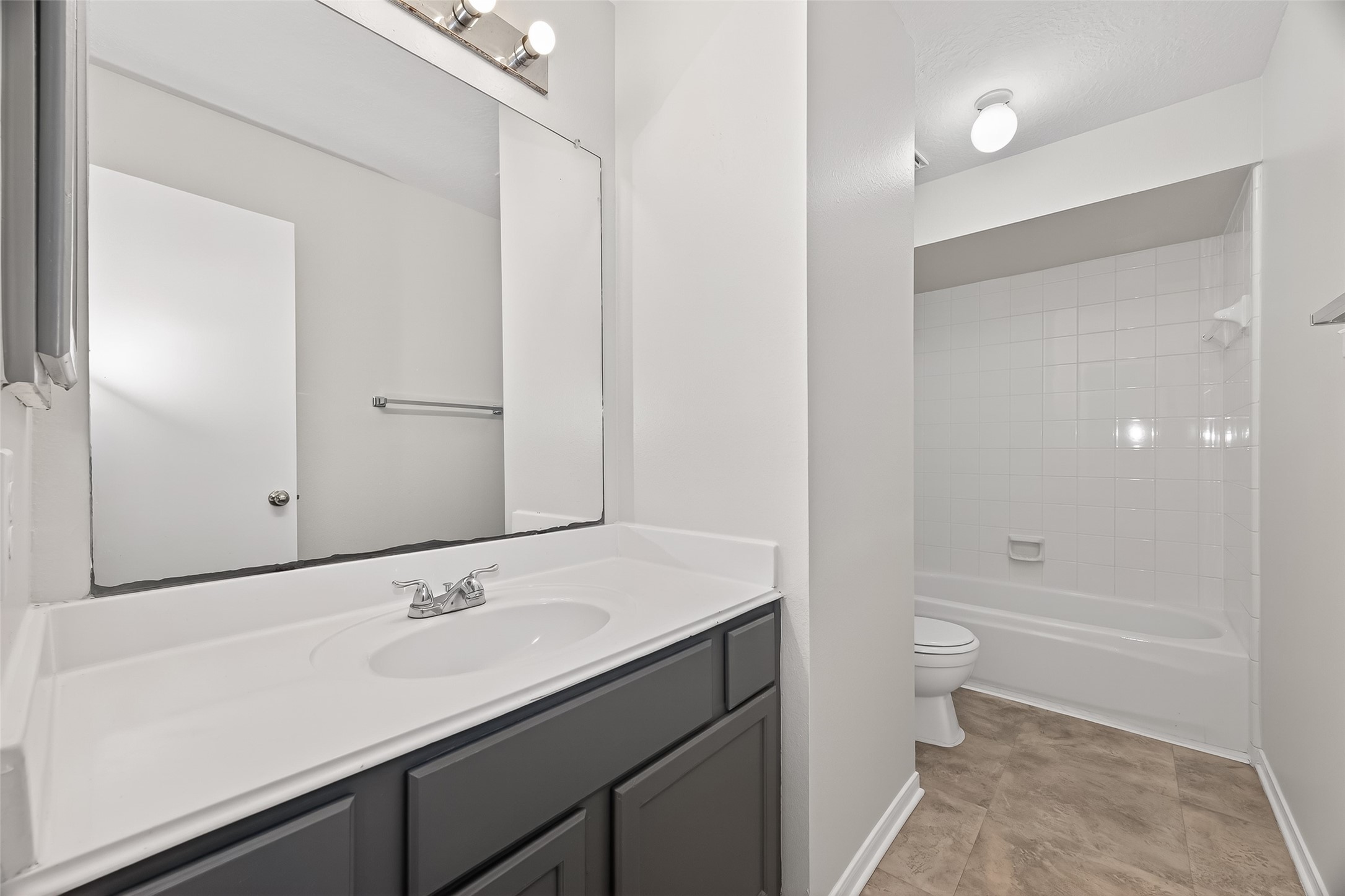 5439 Baslow Drive Katy, TX 77449 - Photo 21 of 31 a bathroom with a sink a toilet and shower