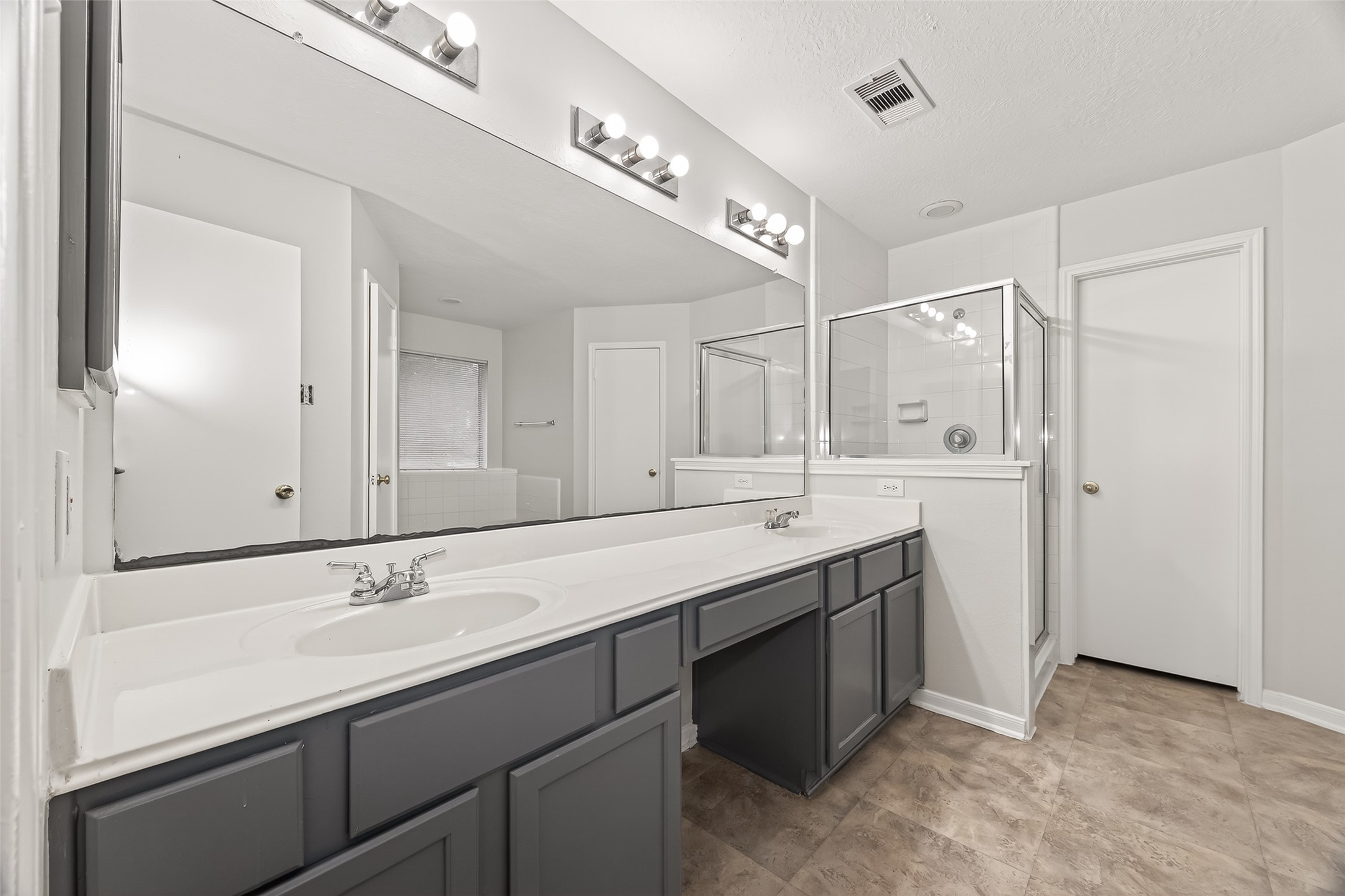 5439 Baslow Drive Katy, TX 77449 - Photo 29 of 31 a bathroom with a sink double vanity and a mirror