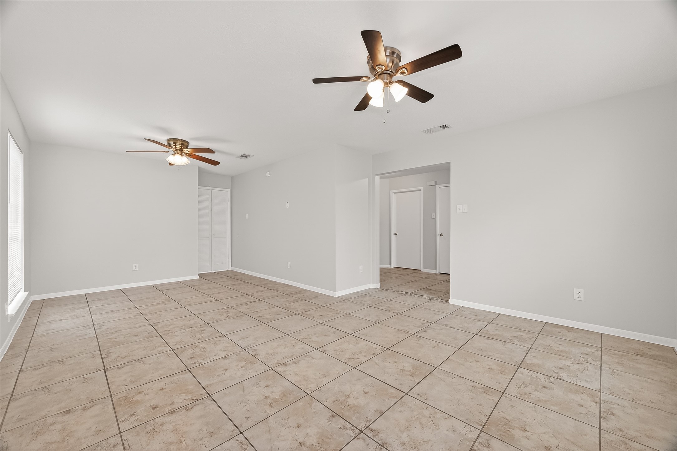 5439 Baslow Drive Katy, TX 77449 - Photo 5 of 31 a view of a livingroom with a ceiling fan and window