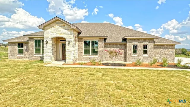 a front view of a house with a ocean view