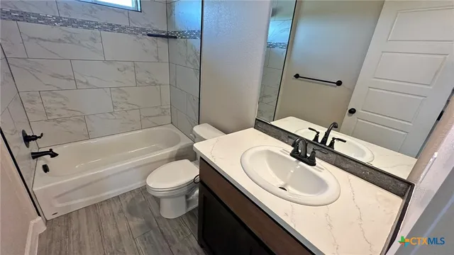 a view of front door and wooden floor