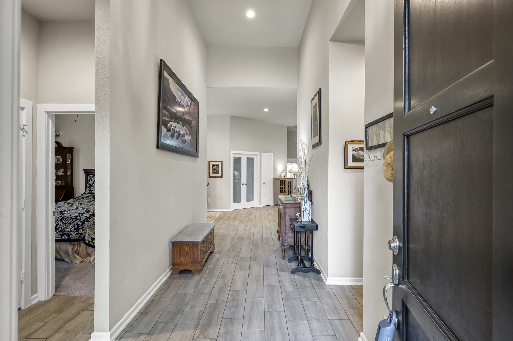 111 Yellow Perch Way Conroe, TX 77318 - Photo 3 of 35 Grand entryway with hallways leading to three secondary bedrooms and two full bathrooms.
