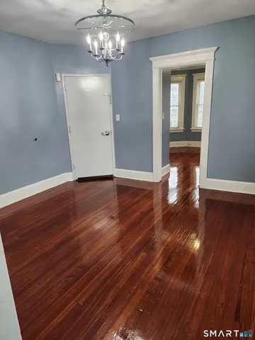 a view of a livingroom with wooden floor