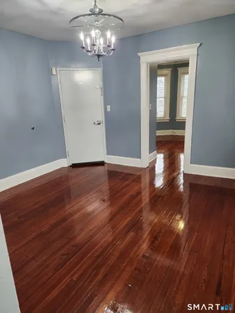 a view of a livingroom with wooden floor