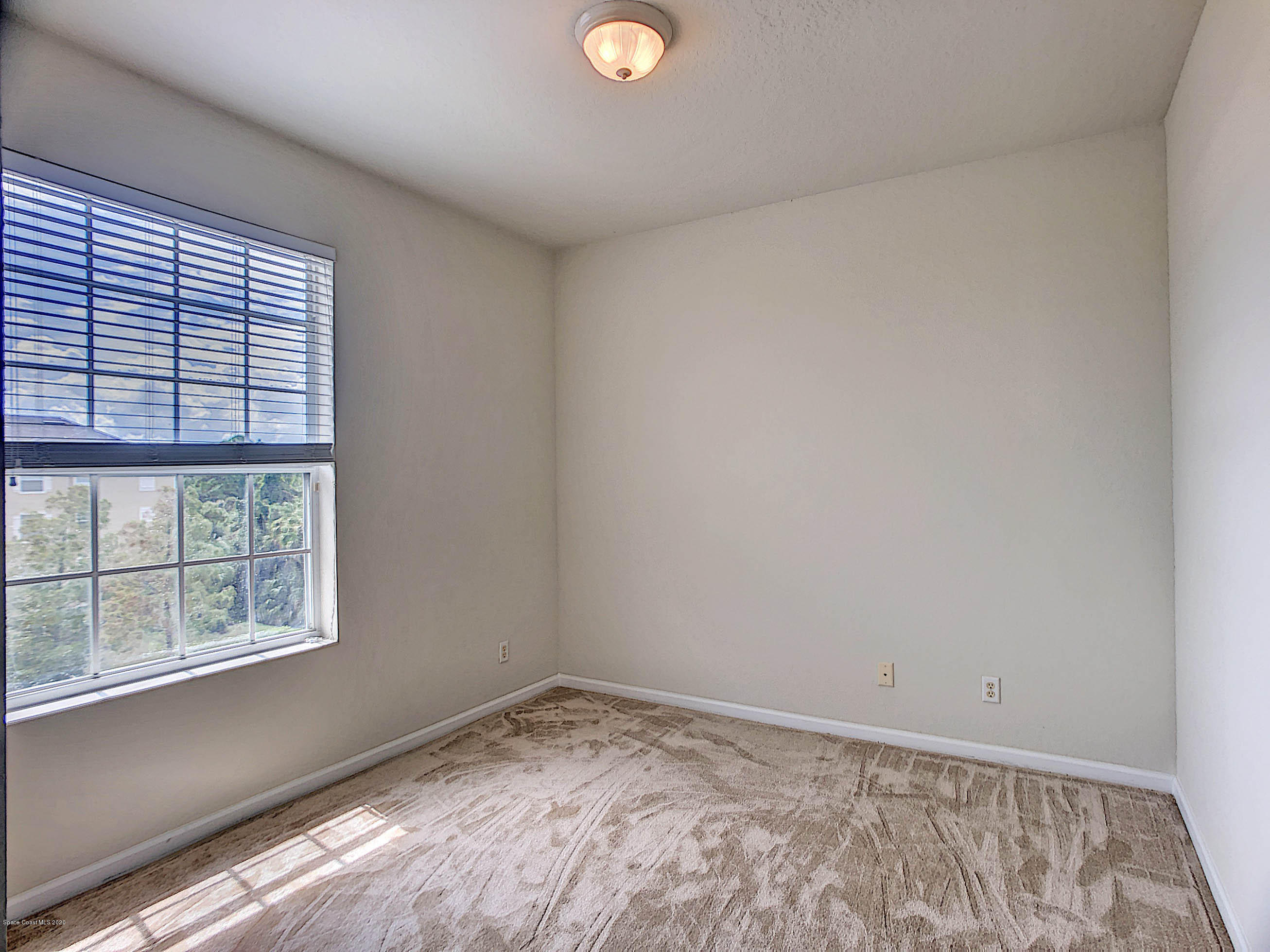 3848 Lexmark Lane, Unit 401 Rockledge, FL 32955 - Photo 17 of 23 Guest Bedroom