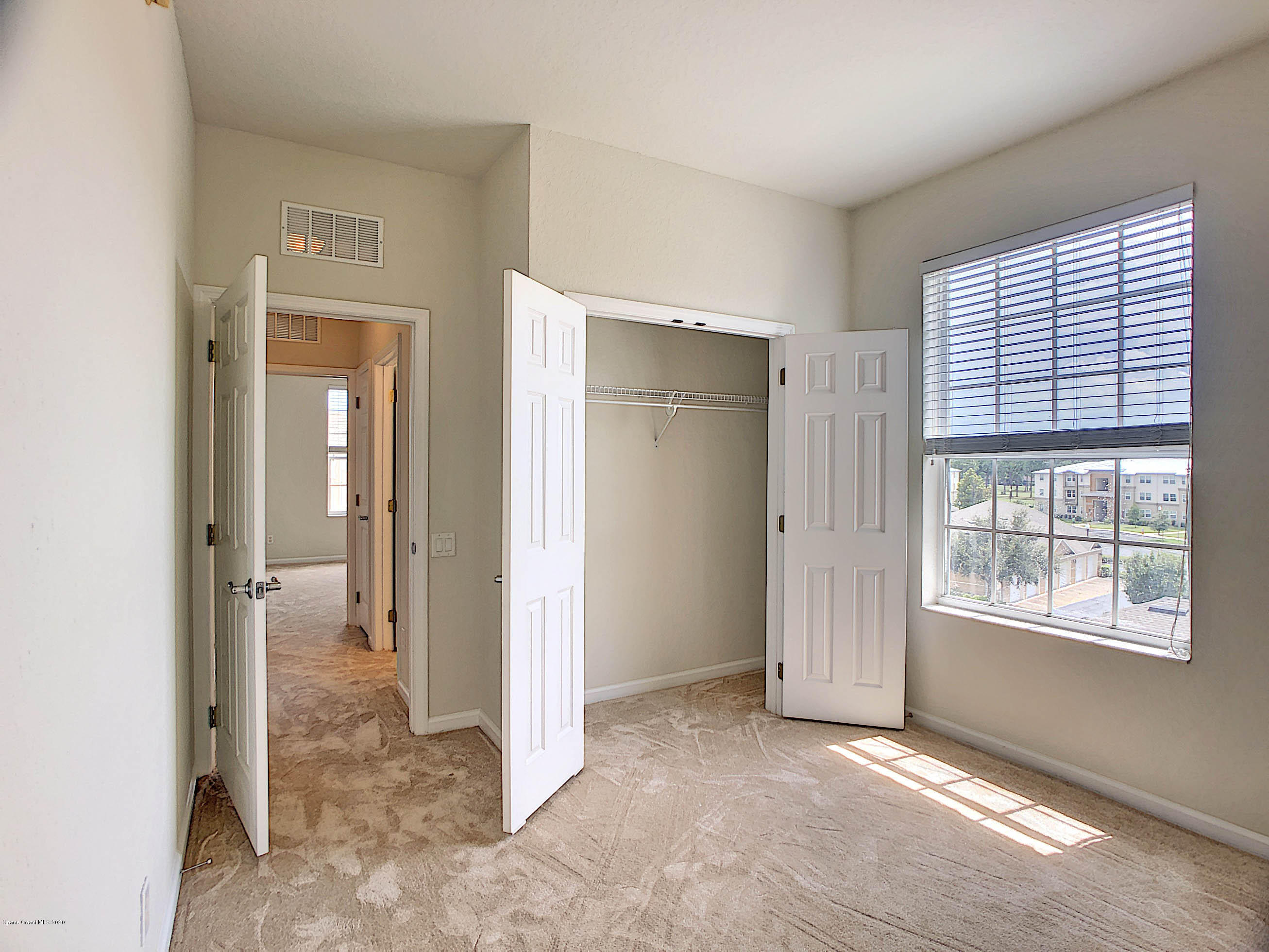 3848 Lexmark Lane, Unit 401 Rockledge, FL 32955 - Photo 18 of 23 Guest Bedroom