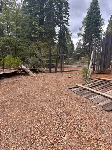 a backyard of a house with portable swings and slides