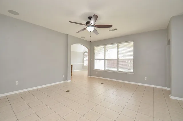 a view of an empty room with a window