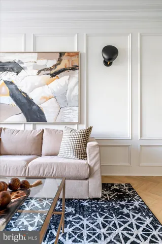 a bedroom with furniture and a large window