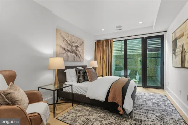 a bedroom with a bed and a lamp