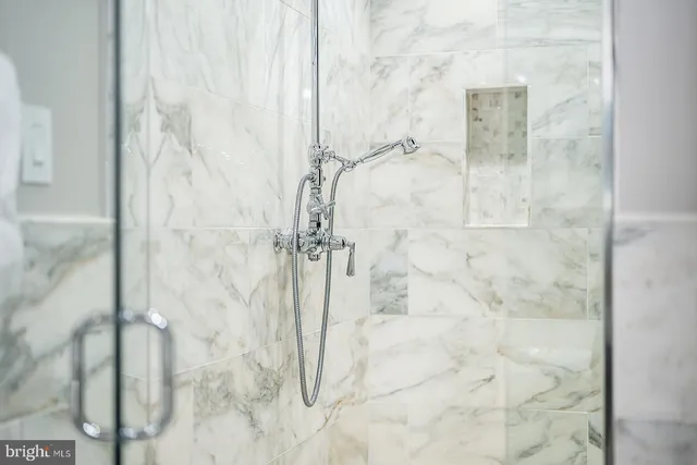 a bathroom with a sink mirror and vanity