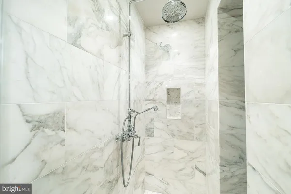 a bathroom with a sink mirror and vanity