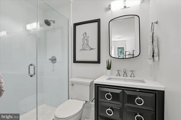 a dining room with furniture and a window