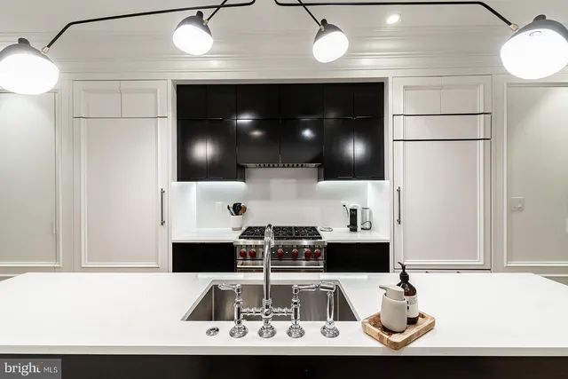 a view of a living room with a fireplace and furniture