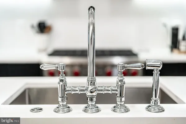 a kitchen with a stove and a sink