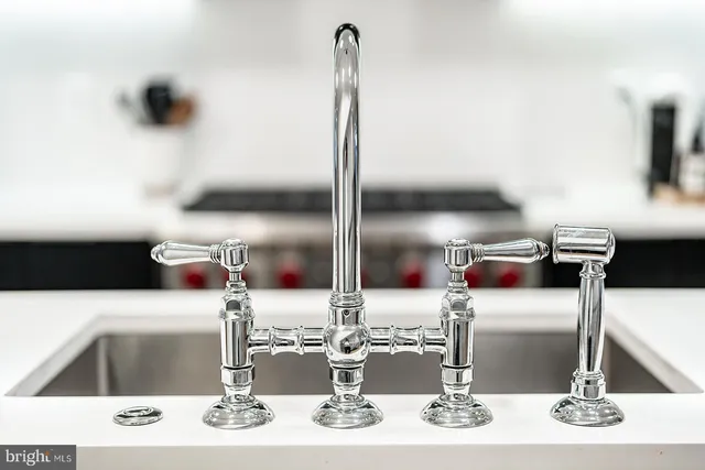 a kitchen with a stove and a sink