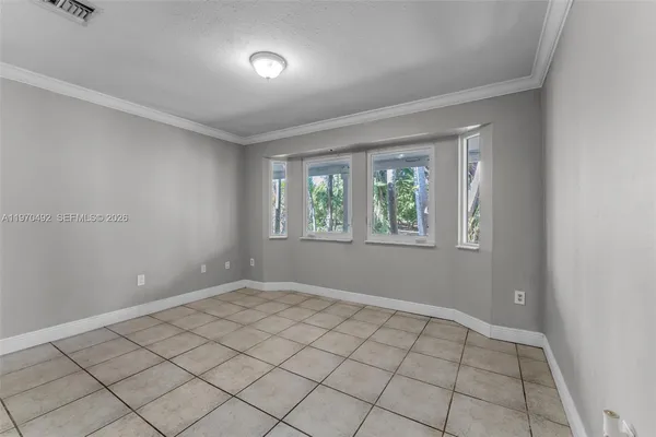 a kitchen with sink cabinets and window