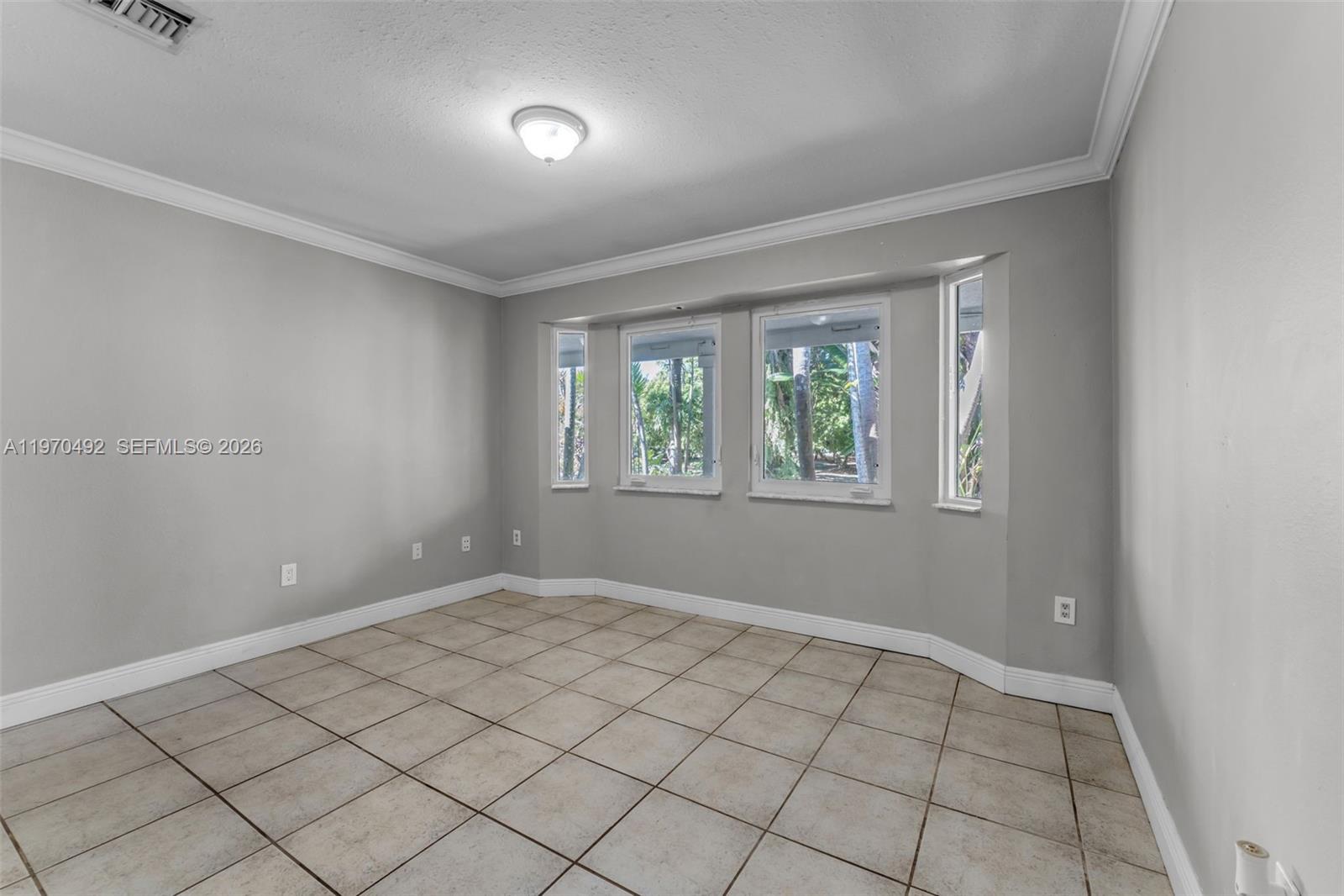 20076 Southwest 190th Street Miami, FL 33187 - Photo 18 of 32 a view of an empty room and window