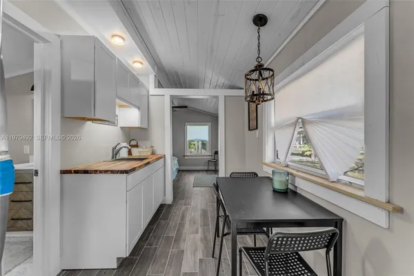 a bedroom with a bed furniture and a window