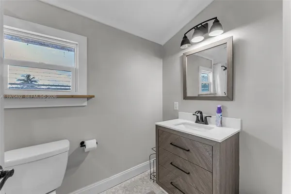a bathroom with a shower and toilet