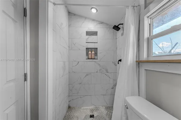 swimming pool view with a garden