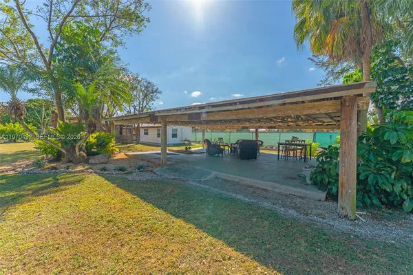 a view of a patio with swimming pool
